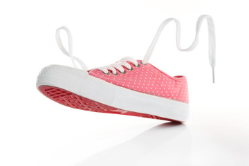 Pink gumshoe isolated on white