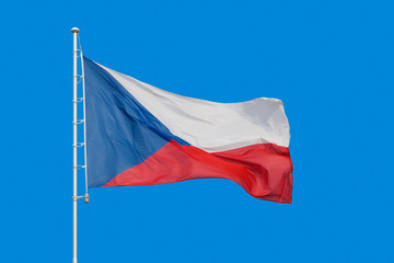 Naklejka na ściany i meble Flag of Czech Republic waving in blue sky