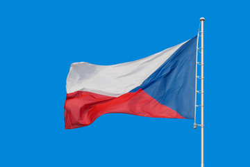 Flag of Czech Republic waving in blue sky.