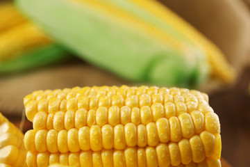Ripe corn on wooden background