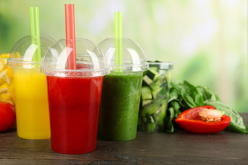 Fresh juice mix fruit, healthy drinks on wooden table, on bright background