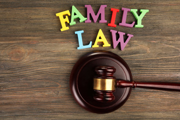 A gavel and colourful letters regarding child-custody and family-law concept