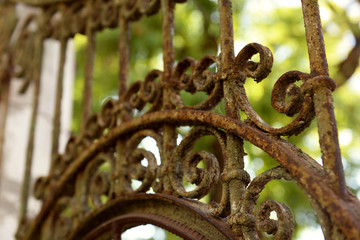 Old rusty forged fence, close up
