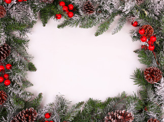 Border, frame from christmas tree branches with pine cones 