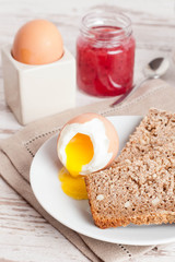 boiled egg, bread and jam for breakfast