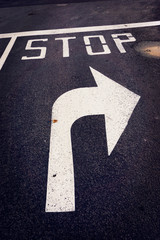 Stop before turn right arrow on street