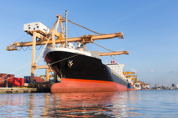 Cargo ship in the harbor for logistic import export background
