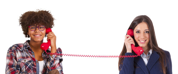 two girls talking on the phone