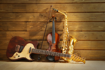 Musical instruments on wooden background