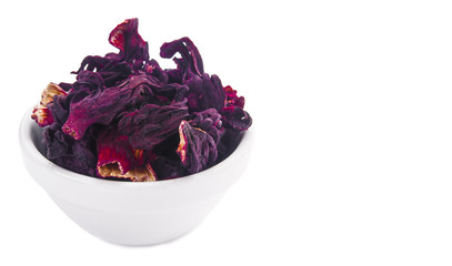 Dried hibiscus went into a white porcelain bowl