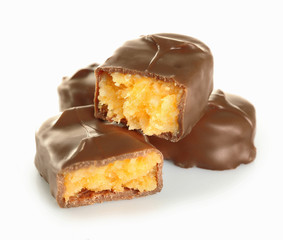 Tasty broken chocolate bars isolated on white background