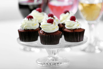 Tasting of wine and chocolate cupcakes, close up