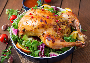 Baked chicken stuffed with rice for Christmas dinner on a festive table