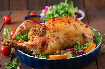 Baked chicken stuffed with rice for Christmas dinner on a festive table