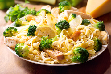 plate of pasta with chicken and broccoli