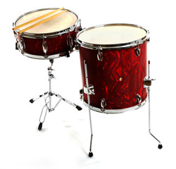 Red drums with drum sticks isolated on white background