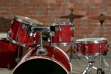 Drum set on brick wall background