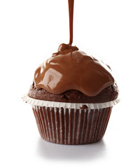 Delicious cupcake with melted chocolate topping, isolated on white