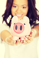 African woman with piggybank.