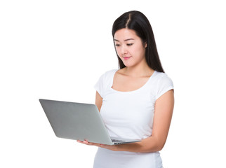 Asian Woman use of the laptop computer