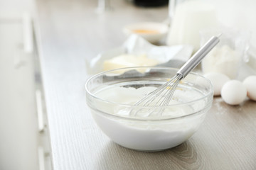 Cooking buttery cream on kitchen