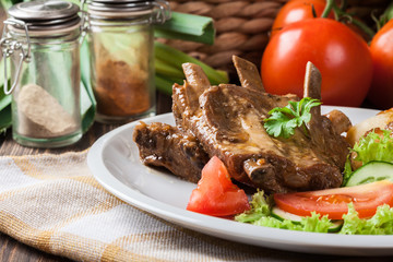 Pork spareribs served with silesian noodles and sauce