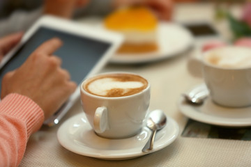 Woman taking photo of food in cafe