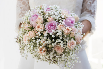 Bride holding a wedding bouket
