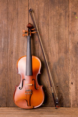Fototapeta na wymiar violin in vintage style on wood background