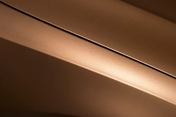Fotobehang Surface of bronze sport sedan car, detail of metal hood and fender of vehicle bodywork  © antonmatveev