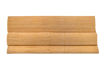 rolled bamboo mats on white background