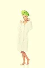 Spa woman in bathrobe and turban.