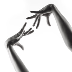 Ballet dancer hands over white