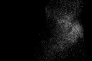 abstract white dust explosion  on a black background. abstract white powder. design elements. abstract texture.