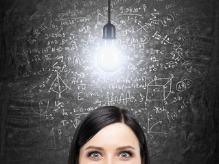 A forehead of brunette woman who is thinking about solution of complicated math problem. Math...