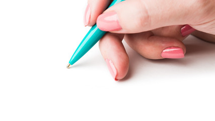 Close up of women hand writing with metallic pen.