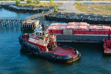 Tugboat by Barge at Pier