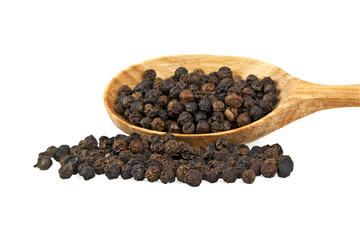 Close-up of peppercorns in wooden spoon on white background