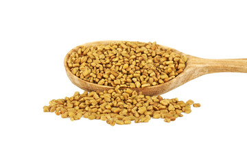 Fenugreek seeds in wooden spoon isolated on white background