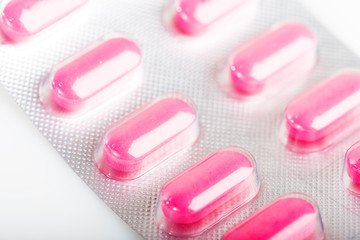 Obraz na płótnie Canvas Pink tablet pills in blister