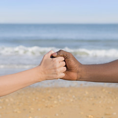 Man and woman holding each other s hand, symbol of love and diversity
