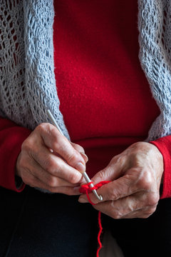 The old lady crochet with skill and experience