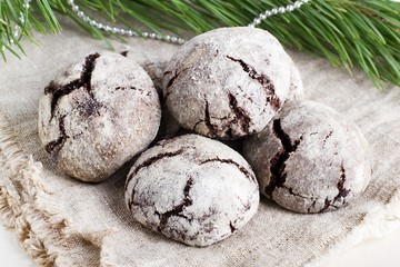 Biscuits with chocolate cracks on a festive background