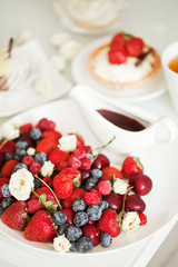 Yummy breakfast - sweet cake with tea and berries - health and non diet concept