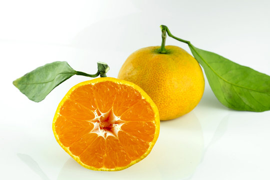 Orange fruit half on white background