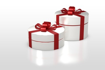 white round gift box with red ribbon