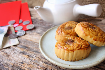 Red envelope with festival moon cake in chinese new year festival