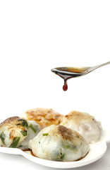 steamed chives dumplings isolated on white background (can stuffed with garlic chives or taro or yam bean mixed with small shrimp)