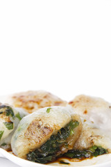 steamed chives dumplings isolated on white background (can stuffed with garlic chives or taro or yam bean mixed with small shrimp)