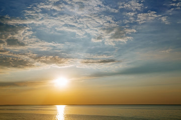 Sunset with sun rays and clouds